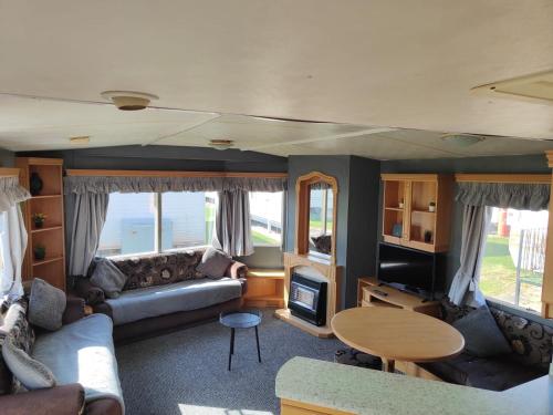 Posezení v ubytování 6-Bed Seaside Caravan Free Wifi Pets Welcome