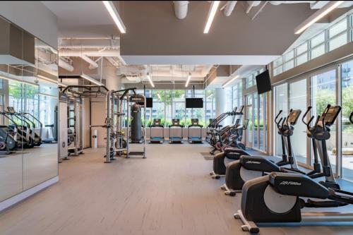 a gym with treadmills and elliptical machines at 2BR Panoramic City View!! in Los Angeles