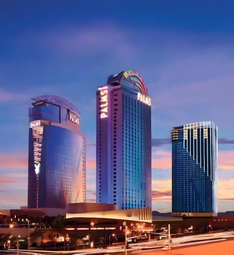 three tall buildings in a city at sunset at Palms Place in Las Vegas