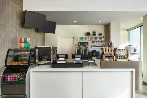 a kitchen with a white counter top with food at The Westin Denver International Airport in Denver