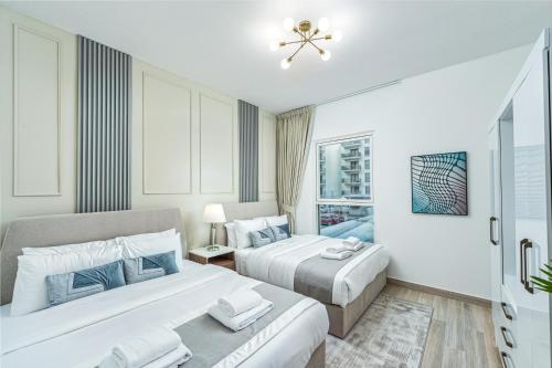 Ein Bett oder Betten in einem Zimmer der Unterkunft Desert Key - Perfectly Located Yas Island Premier Apts