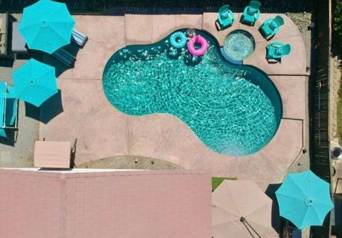 an overhead view of a swimming pool with a painting of a fish at Coachella Private Pool Fire Pit BBQ with Chefs Kitchen in Indio