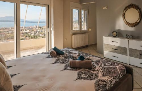 Ένα ή περισσότερα κρεβάτια σε δωμάτιο στο Villa Butterfly Igoumenitsa