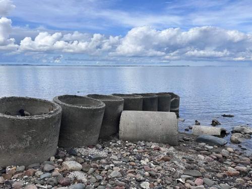 a group of concrete barriers on the shore of a body of water at 6 person holiday home in Fur-By Traum in Fur