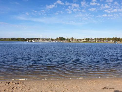 a large body of water with buildings in the background at 4 person holiday home in Højslev-By Traum in Højslev