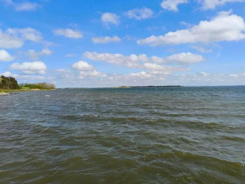 a view of a large body of water at Light-filled Retreat in Boddum - By Traum Ferienwohnungen in Boddum
