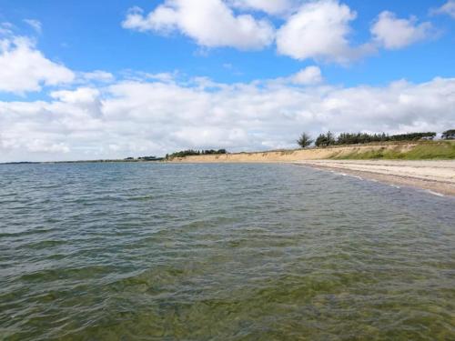 a view of the shore of a beach at 4 star holiday home in Øster Assels-By Traum in Øster Assels