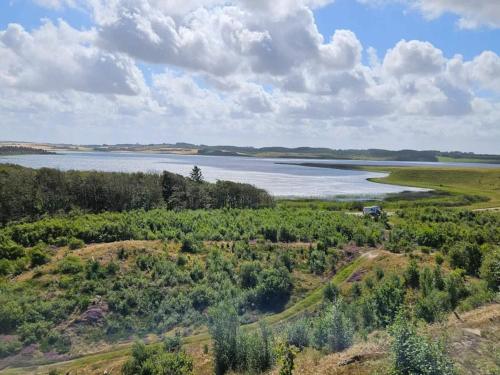 an aerial view of a river and a field at 4 star holiday home in Thisted-By Traum in Thisted