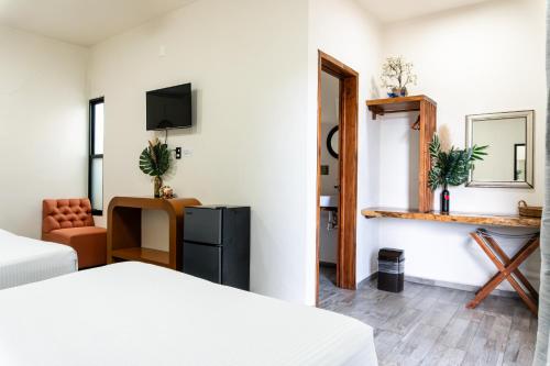 Hotel Brisas Bacalarにあるベッド