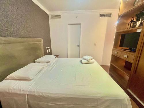 Ένα ή περισσότερα κρεβάτια σε δωμάτιο στο LFlats Hotel Oscar Freire