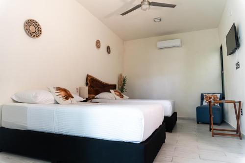 Hotel Brisas Bacalarにあるベッド