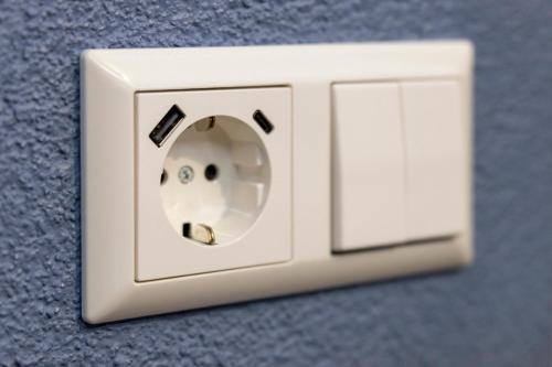 a white light switch on a wall at Hotel Residenz Luxury - Outletcity - Parken - Klima - 24h Check-In in Metzingen