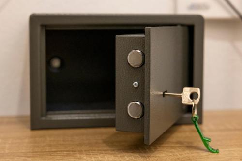 a black tv with a green cord plugged into it at Hotel Residenz Luxury - Outletcity - Parken - Klima - 24h Check-In in Metzingen