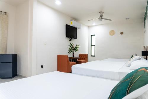 Hotel Brisas Bacalarにあるベッド