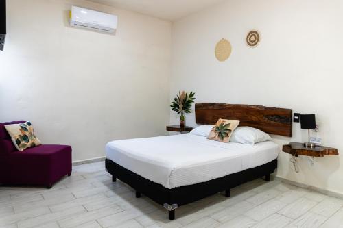 Hotel Brisas Bacalarにあるベッド