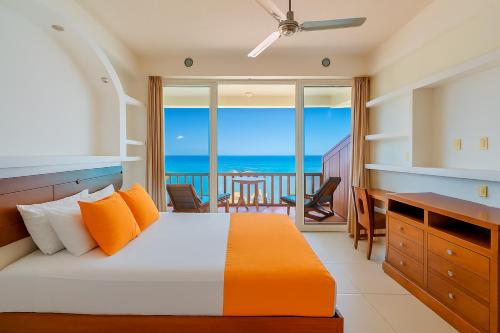 a bedroom with a bed with a view of the ocean at Punta Mita Litibu Beachfront Studios Mar-3 in Punta Mita