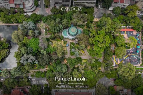 a map of a park with a building and trees at Capitalia Parque Lincoln in Mexico City