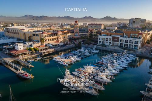 an aerial view of a marina with boats in the water at Paraiso Residences Marina Cabo by Capitalia in Cabo San Lucas