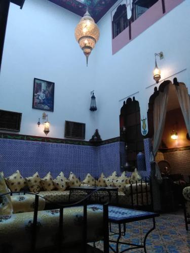 a room with a couch with pillows on it at Maison Adam in Fès