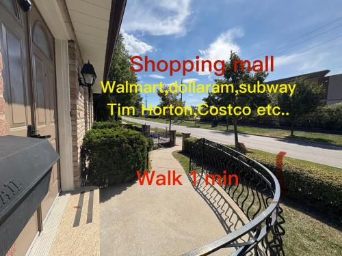 a walkway outside of a house with a fence at 9mins airport 1 min to shopping mall in Toronto
