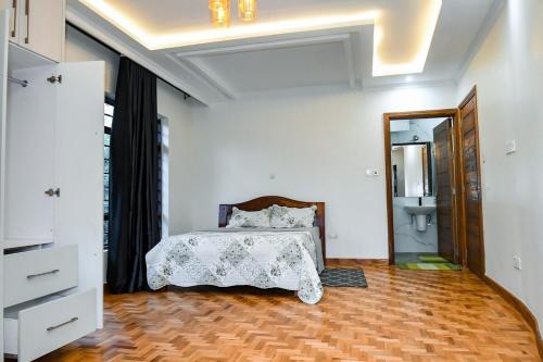 Ein Bett oder Betten in einem Zimmer der Unterkunft Atambo's Crescent