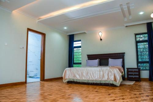 Ein Bett oder Betten in einem Zimmer der Unterkunft Atambo's Crescent