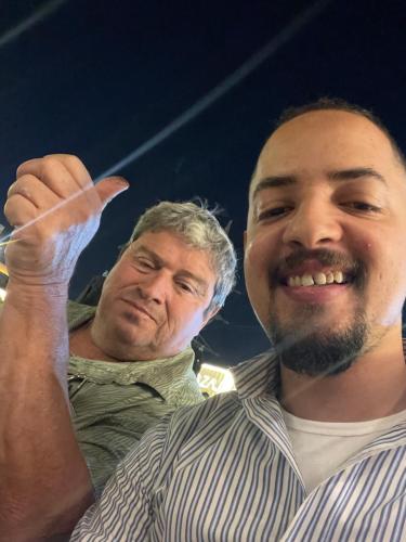 two men standing next to each other with their finger in the air at Farida Pyramids ŌTEL in Cairo