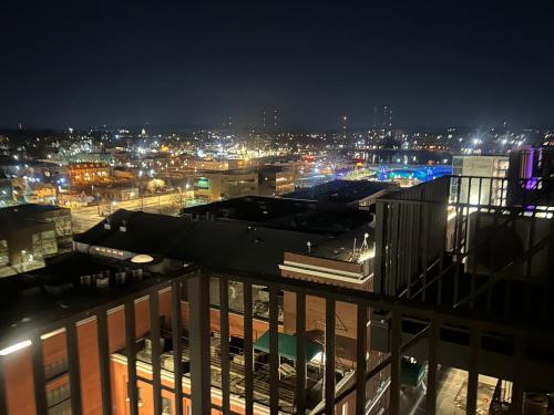 a view of a city at night with lights at Luxury High Rise Downtown Apartment in South Bend
