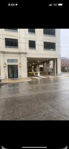 an empty parking lot in front of a building at Luxury High Rise Downtown Apartment in South Bend