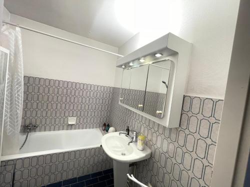 a bathroom with a sink and a bath tub at - - - - - Au Sixième Ciel - - - - - in Brussels