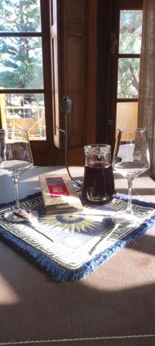 a table with a glass jar on top of a table at Finca La Encantada in San Rafael