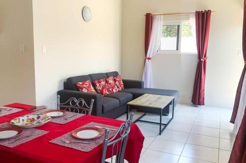 a living room with a couch and a table at Guest Favorite - Central - Gated - 2 Bedrooms in Willemstad