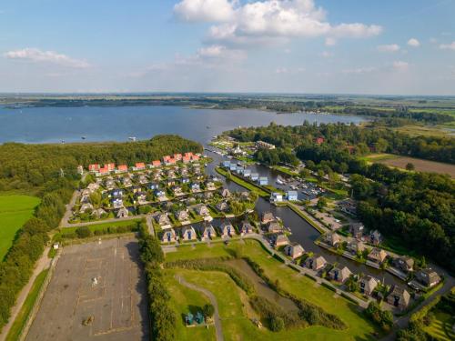 an aerial view of a park next to a river at Scenic Holiday Chalet in Drenthe in Midlaren