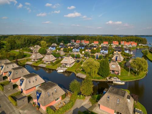 an aerial view of a village on a river at Waterfront Villa Near Groningen in Midlaren