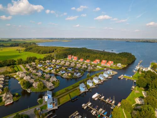 an aerial view of a marina with boats at Waterfront Villa Near Groningen in Midlaren