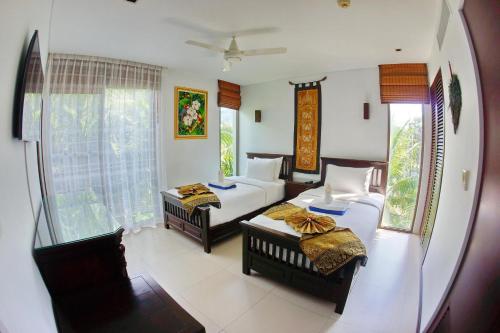 Ένα ή περισσότερα κρεβάτια σε δωμάτιο στο Casuarina Shores Apartment - SHA Plus