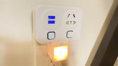 a lightswitch on a wall with a light on it at Central Spot Elegant Home Fresh Features in Auckland