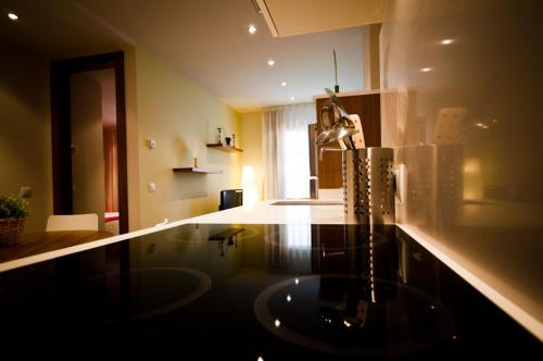 a bathroom with a sink in a room at Apartamentos Abaco in Llanes