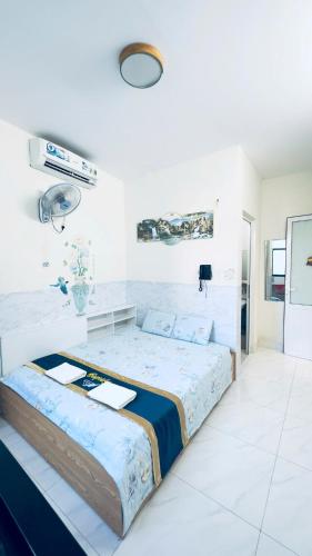 Ένα ή περισσότερα κρεβάτια σε δωμάτιο στο Spring Homestay