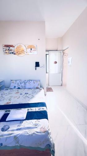 Ένα ή περισσότερα κρεβάτια σε δωμάτιο στο Spring Homestay