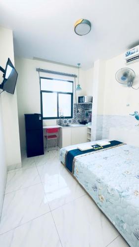 Ένα ή περισσότερα κρεβάτια σε δωμάτιο στο Spring Homestay