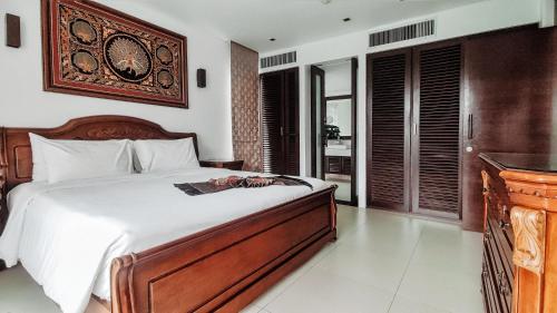 Ένα ή περισσότερα κρεβάτια σε δωμάτιο στο Casuarina Shores Apartment - SHA Plus