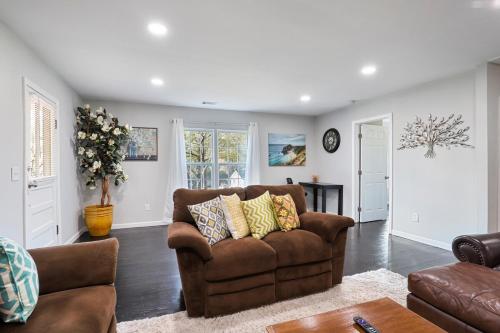 a living room with a couch and a table at Beautiful Marietta GA 3 Bedroom 2 and a half Bath in Marietta