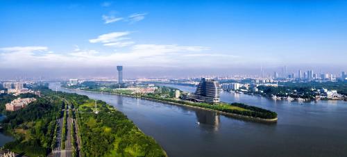 an aerial view of a river with a city at Vignette Collection The Xanadu Guangzhou, an IHG Hotel in Guangzhou