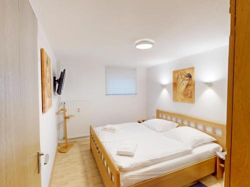 a bedroom with a bed in a room at Knechtsand - 403 in Cuxhaven