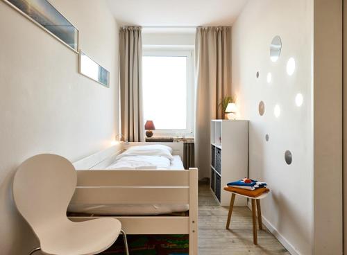 Postel nebo postele na pokoji v ubytování Rotesand - 128