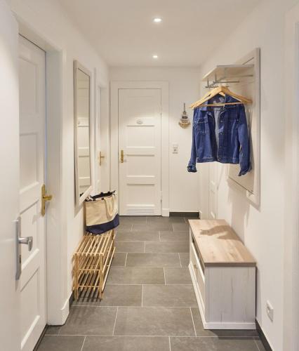 a room with a hallway with a door and a hallway at Strandhus Cuxi - 2 in Cuxhaven