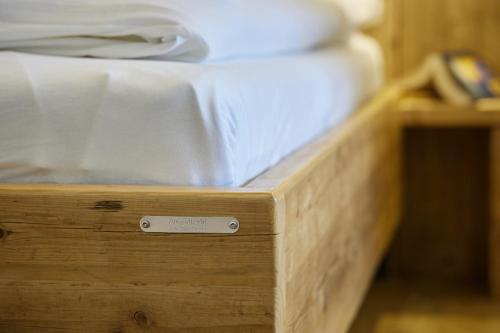 a wooden bed box with a mattress on it at Nautic - 306 in Cuxhaven
