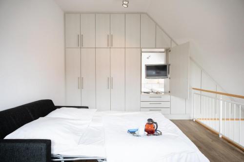 a bedroom with a bed with a toy on it at Hohe Lith - 335 in Cuxhaven