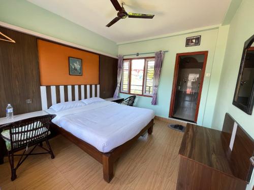 Postel nebo postele na pokoji v ubytování Nanohana Lodge